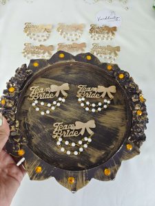 Team Bride badge adorned with pearls, suitable for bridal party gifts and wedding attire accessories. Perfect for Nikah ceremonies