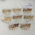 Team Bride brooches featuring pearls and a gold bow, perfect for wedding favors, bride side badges, and lehenga accessories