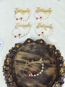 Charming Betiwale brooch with intricate designs, featuring pearls and red beads. Ideal for nikah ceremonies, wedding favors, bridal badges, and wedding attire accessories