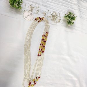 Milni Mala features lustrous pearls combined with vibrant yellow and red beads, perfect for welcoming guests at wedding ceremonies. Ideal for the Nikah ceremony, it also serves as a stunning wedding favor