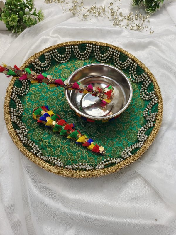 mehndi ceremony platter with intricate lace and pearl detailing, adorned with yellow flowers and traditional embellishments