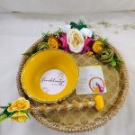 Beautiful golden Haldi ceremony platter with lace and pearl detailing, complemented by yellow flowers. or Haldi, Mehndi, or Nikah ceremonies, it adds a touch of elegance to your wedding rituals and serves as a charming wedding favor