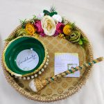 Haldi ceremony platter in gold, adorned with pearls and yellow flowers Haldi, Mehndi, or Nikah ceremonies, offering a beautiful wedding favor that enhances the beauty and meaning of your special moments.