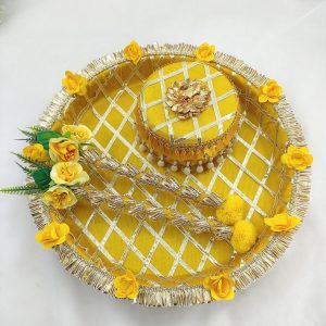 Beautiful yellow and gold steel platter for Haldi and Henna ceremonies, adorned with floral accents and decorative details The centerpiece features a beautifully crafted round box with pearl accents, perfect for holding Haldi, Henna wedding favor
