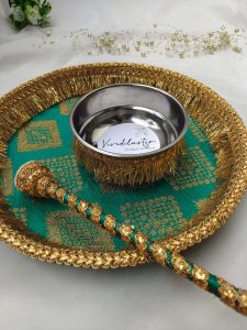 mehndi platter with intricate detailing and a matching brush, adorned with gold lace, perfect for bridal mehndi ceremonies serves as the perfect accessory for your Mehndi rituals.