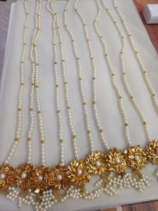 Traditional Gota Pearl Welcome Mala featuring pearls and gota work for wedding favors