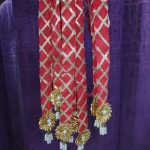 Dupatta-style pearl welcome milni mala featuring red and gold accents with intricate pearl and floral embellishments, perfect for nikah ceremony welcome mala, wedding favor, and guest mala