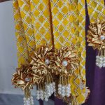 Handcrafted moti haar with a yellow and gold lattice design, adorned with golden flowers and pearls, ideal for baaratis mala, punjabi milni gift, and decorative mala