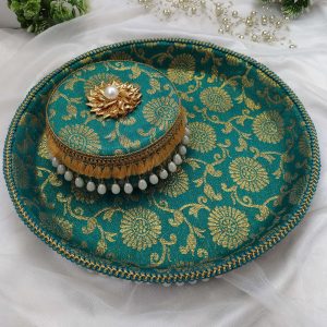 Green and gold bangle chura ceremony platter with intricate floral motifs and pearl tassel border or the bride's bangle chura ceremony, this platter beautifully displays the ceremonial bangles