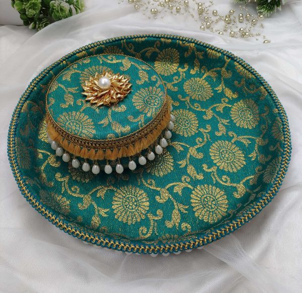 Green and gold bangle chura ceremony platter with intricate floral motifs and pearl tassel border or the bride's bangle chura ceremony, this platter beautifully displays the ceremonial bangles