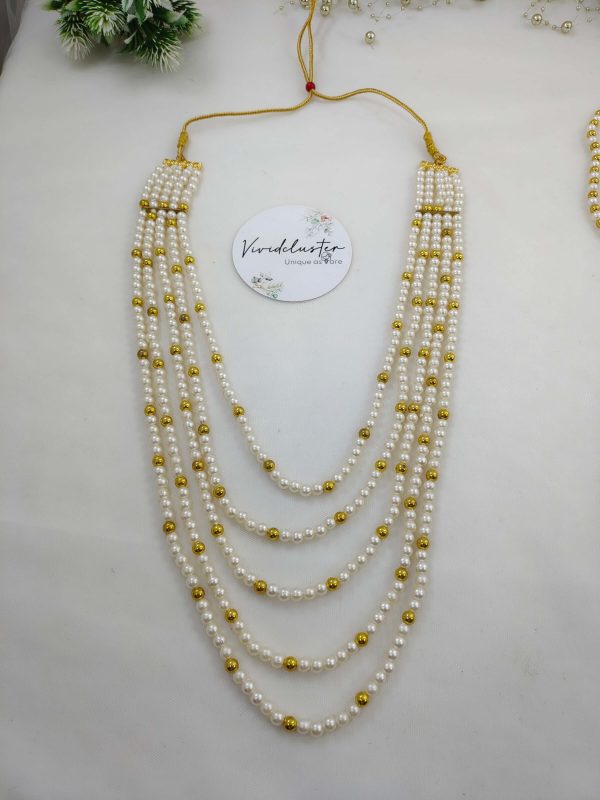 Multi-layered Welcome Milni Mala with gold and white pearls, perfect for traditional ceremonies