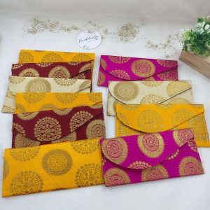 wedding envelopes in vibrant pink and orange hues, perfect for nikah ceremony envelope, wedding favor, shagun giveaway gift, and shagun lifafa, adorned with delicate golden trim