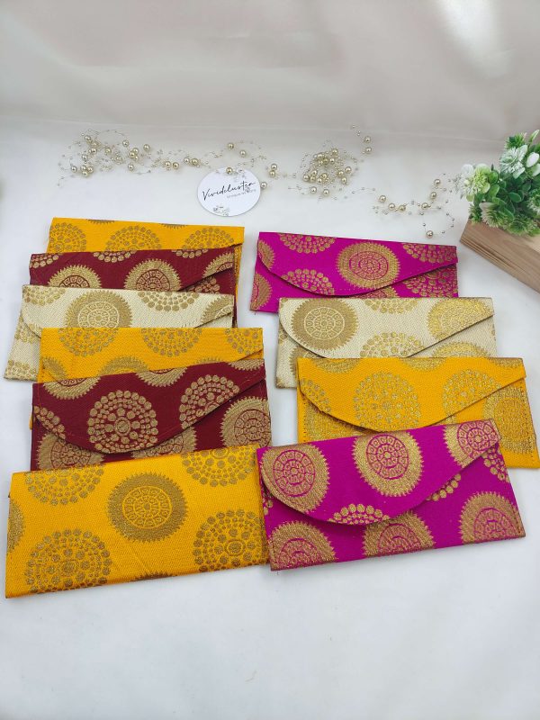 wedding envelopes in vibrant pink and orange hues, perfect for nikah ceremony envelope, wedding favor, shagun giveaway gift, and shagun lifafa, adorned with delicate golden trim