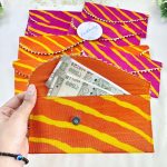 handcrafted shagun lifafa in rich pink and orange, featuring intricate gota, perfect for shagun ceremony giveaways and bridal shower favors