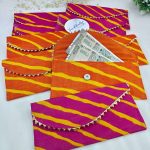 Handcrafted embroidery envelopes in vibrant pink and orange hues, perfect for nikah ceremony envelope, wedding favor, shagun giveaway gift, and shagun lifafa, adorned with delicate golden trim