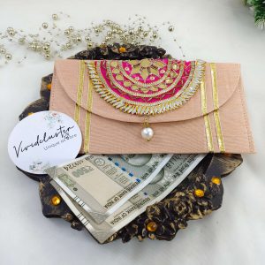 Beautifully designed yellow envelope with gota work and pearls, ideal for nikah ceremony favors