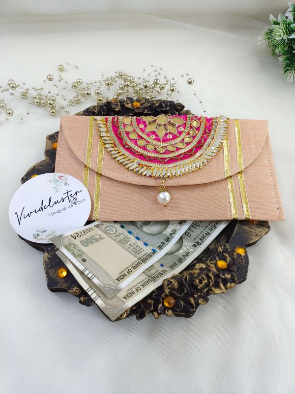Beautifully designed yellow envelope with gota work and pearls, ideal for nikah ceremony favors