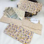 Colorful printed shagun envelopes adorned with intricate designs, perfect for shagun lifafa and wedding ceremonies