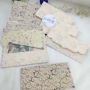 Colorful printed shagun cash envelopes featuring traditional designs, suitable for wedding favors and special celebrations