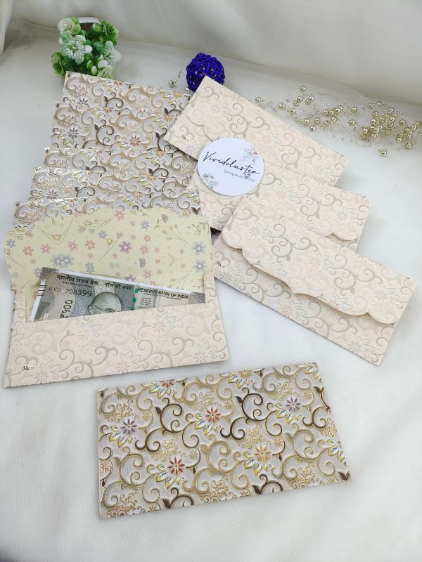 Colorful printed shagun cash envelopes featuring traditional designs, suitable for wedding favors and special celebrations