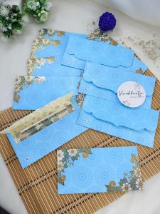 flower paper printed shagun envelope designed to add a touch of elegance to any wedding ceremony. This beautifully crafted envelope features vibrant floral patterns, perfect for presenting shagun gifts during traditional Indian weddings