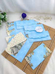 Beautiful flower paper printed shagun envelope designed for weddings, featuring vibrant floral patterns that add a touch of elegance to any ceremony. Perfect for presenting shagun gifts, engagement tokens, or bridal favors, this high-quality envelope is crafted from durable paper