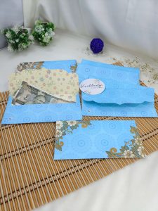 Stunning flower paper printed shagun envelope designed to elevate any wedding ceremony. This envelope features a beautiful floral pattern, perfect for presenting shagun gifts, engagement tokens, or bridal shower favors. Crafted from premium paper
