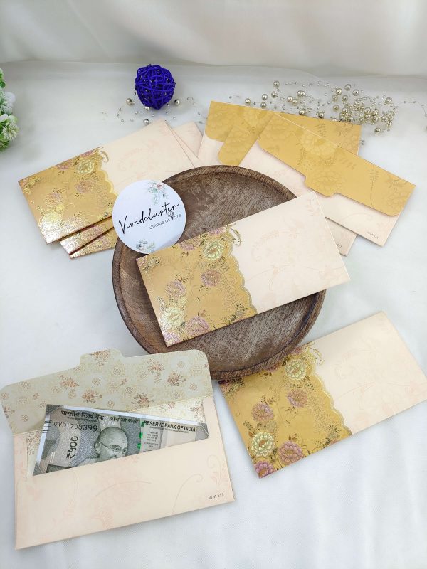 Designer shagun envelopes with rich golden detailing, perfect for wedding and engagement ceremonies