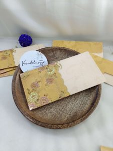 Elegant shagun lifafa with intricate gold designs, ideal for weddings and festive celebrations