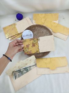 Elegant shagun lifafa with intricate gold designs, ideal for weddings and festive celebrations