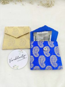 collection of colorful shagun lifafas, this set includes envelopes in hues of green, pink, blue, orange, yellow, and more. These traditional and intricately designed envelopes are perfect for wedding favors