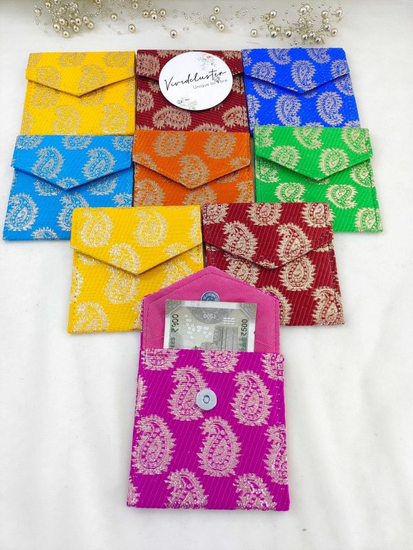 showcases a set of vibrant wedding shagun envelopes in various colors including green, pink, blue, orange, and yellow, each adorned with intricate traditional patterns. Perfect for nikah ceremonies, wedding favors, shagun giveaways