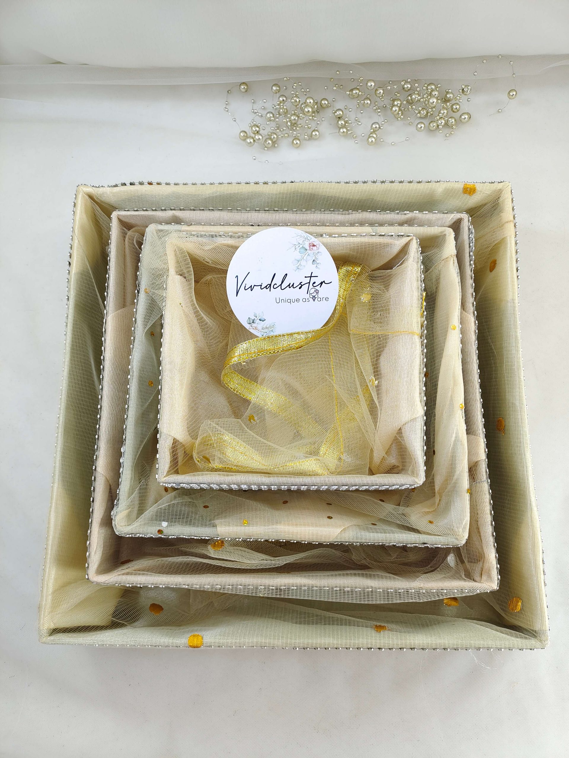 High-quality MDF shagun tray adorned with net fabric, perfect for Haldi, Mehendi, and Sangeet return gifts