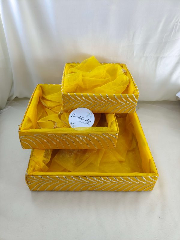 Beautifully handcrafted shagun tray made of MDF and net, ideal for sangeet and engagement ceremonies. Perfect for return gifts, guest giveaways, and baby showers. This vibrant yellow marriage tray