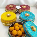 Vibrant brocade wedding favor boxs with luxurious gold and pearl decorations for bridesmaid's gifts, guest gifts, or as a special wedding favor laddu boxes