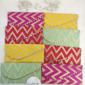 Handcrafted embroidery envelopes in vibrant pink and orange hues, perfect for nikah ceremony envelope, wedding favor, shagun giveaway gift, and shagun lifafa, adorned with delicate golden trim