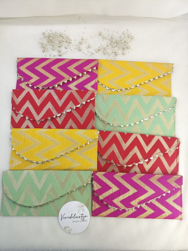 Handcrafted embroidery envelopes in vibrant pink and orange hues, perfect for nikah ceremony envelope, wedding favor, shagun giveaway gift, and shagun lifafa, adorned with delicate golden trim