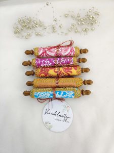 A collection of traditional roller envelopes in vibrant colors, perfect for nikah ceremonies, shagun giveaways, and wedding favors. Each envelope is beautifully decorated with intricate patterns and golden embellishments