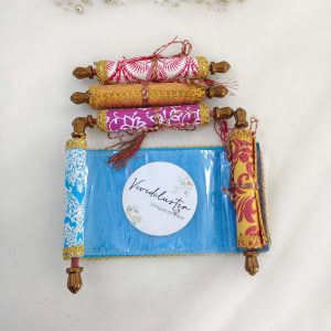 A set of roller shagun envelopes in various colors, perfect for wedding favors, shagun giveaways, and nikah ceremonies. These beautifully designed envelopes are adorned with intricate patterns and golden accents