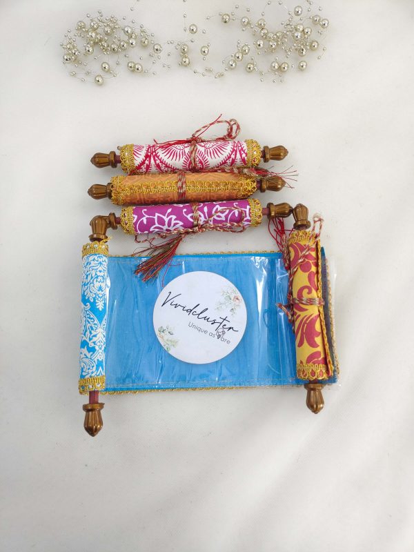 A set of roller shagun envelopes in various colors, perfect for wedding favors, shagun giveaways, and nikah ceremonies. These beautifully designed envelopes are adorned with intricate patterns and golden accents