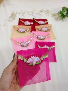 Beautifully crafted lotus net shagun envelopes adorned with a delicate lotus flower and golden trim, ideal for shagun giveaways and bridal showers