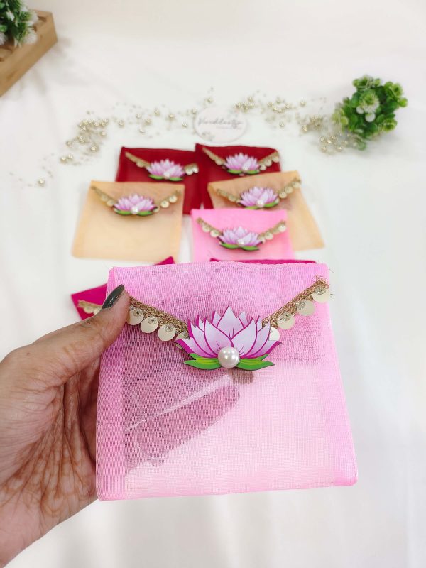Assorted colorful lotus net shagun envelopes featuring golden lace and a lotus embellishment, suitable for shagun lifafa and baby showers