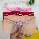 Beautifully crafted lotus net shagun envelopes adorned with a delicate lotus flower and golden trim, ideal for shagun giveaways and bridal showers