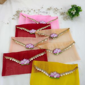 colorful lotus net shagun envelopes featuring golden lace and a lotus embellishment, suitable for shagun lifafa and baby showers.