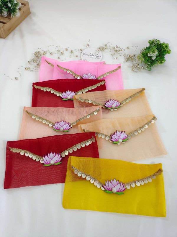 colorful lotus net shagun envelopes featuring golden lace and a lotus embellishment, suitable for shagun lifafa and baby showers.