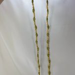 Handcrafted wedding necklace featuring a stunning green beaded bridal mala with intricate golden details for your bride to look gorgeous in her haldi mehandi ceremony.