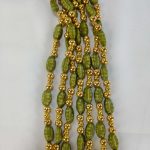 green beaded mala necklace with golden accents, perfect for traditional bridal jewelry at weddings. wedding gift for your bridesmaid for ceremonies