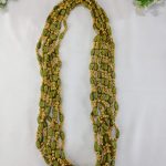 Handcrafted wedding necklace featuring a stunning green beaded bridal mala with intricate golden details for your bride to look gorgeous in her haldi mehandi ceremony.