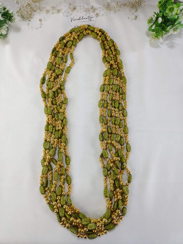 Handcrafted wedding necklace featuring a stunning green beaded bridal mala with intricate golden details for your bride to look gorgeous in her haldi mehandi ceremony.