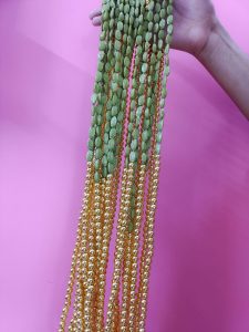 green beaded mala necklace with golden accents, perfect for traditional bridal jewelry at weddings. wedding gift for your bridesmaid for ceremonies